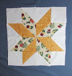 the star is made up of yellow and white fabric, with green leaves on it