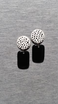 These dangle earrings were constructed from white earthenware clay and painted a solid black rectangle dangle with a round black polka dot top. The measurements of these ceramic earrings are 7/8" width by 2 1/8" length. The earring posts, attached securely to the back, are surgical steel (hypoallergenic base). These artsy earrings will make a fun accessory as well as a great gift that will arrive in a gift box. Please check out our shop for more wearable art. www.etsy.com/shop/pickneycreations Thanks for looking! Artistic Black Dangle Earrings, Black Polymer Clay Earrings For Everyday, Black Hand Painted Drop Earrings, Everyday Black Polymer Clay Earrings, Black Polymer Clay Earrings With Ear Wire, Hand Painted Black Polymer Clay Earrings, Artsy Earrings, Black Polka Dot Top, Earrings Ceramic