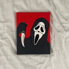 a painting of a person with a knife in their hand and a mask on his face