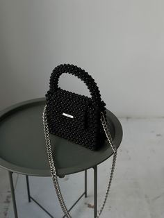 Luxury Black Bag With Pearl Handle, Luxury Black Square Clutch, Black Top Handle Box Bag For Gift, Black Top Handle Box Bag As Gift, Luxury Black Beaded Evening Bag, Elegant Black Beaded Bags, Elegant Black Beaded Clutch, Black Handheld Bags With Pearl Handle, Black Handheld Bag With Pearl Handle