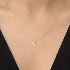 14k Solid Gold Moon Necklace, Yellow Gold Crescent Moon Pendant, Dainty Moon Charm Pendant, Celestial Necklace, Birthday Gift *Free Express International Shipping *14K solid gold chain is included. NEXT BUSINESS DAY SHIPPING! PRODUCT DETAILS *The product is made of 100% 14k Solid Gold and it has a 14K or 585 stamp on item. (We don't sell filled or plated jewelry) *The package includes a gold certificate.  *The product includes 14K solid gold chain. *Every package comes in a gift box. *14K gold indicates that the product is produced from 58% pure gold. *Chain thickness: 0.80 mm /0,023 inches *Pendant (moon charm) measures: 8mm  x 5.70mm *The product is yellow gold. *       Made in Türkiye. ORDER PROCESS *We have some options for the chain length.  ABOUT SHIPPING We ship all packages safely Moon Charm Necklace, Delicate Moon Shaped Jewelry For Anniversary, Delicate Moon-shaped Jewelry For Anniversary, Delicate Moon Charm Jewelry For Anniversary, Dainty Moon Shaped Clavicle Chain Jewelry, Delicate Moon-shaped Jewelry Gift, Delicate Moon Shaped Jewelry For Gift, Elegant Half Moon Charm Necklace For Gifts, Dainty Moon Charm Necklace For Wedding