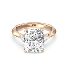 a cushion cut diamond ring with three side stones