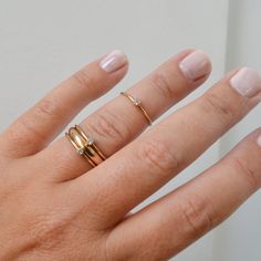 A super cute, minimalist CZ stone ring gives you that barely there feel, with a touch of sparkle. Looks great alone or added to your daily stack! 14K Gold Filled Band is 1mm, CZ stone is 2mm Listing is for ONE RING Gold Filled has 100 times more gold than gold plated jewelry and will not chip or fade with wear! You can swim/shower, etc just like you would with solid gold. Gold filled wire is created by taking a sheet of 14 karat gold and bonding it through extreme heat and pressure to a core of Minimalist Stackable Crystal Toe Ring, Dainty 14k Gold Midi Rings For Everyday, Dainty Everyday Ring With Tiny Details, Delicate Tiny 14k Gold Midi Rings, Dainty Stackable Crystal Open Ring, Dainty 14k Gold Open Midi Rings, Delicate Everyday Stackable 14k Gold Rings, Dainty Initial Ring With Round Band For Everyday, Everyday Delicate 14k Gold Stackable Rings