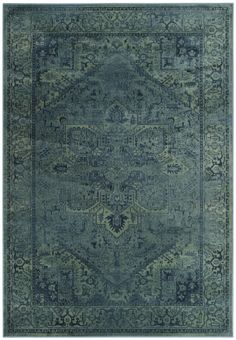 an area rug with blue and green colors