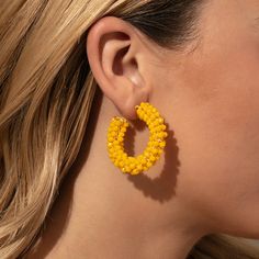 Make a statement this summer with our Beaded Hoops. These dark yellow beaded earrings pair perfectly with all of your favorite gold earrings and all of our other beaded jewelry. Add these statement hoop earrings to your collection and you’ll have an unforgettable look all season long. Gold Beaded Earrings For Summer, Trendy Gold Beaded Earrings For Summer, Trendy Yellow Earrings With Colorful Beads, Trendy Gold Beaded Earrings For Beach, Summer Gold Beaded Earrings, Trendy Gold Beaded Earrings With Colorful Beads, Summer Gold Beads Drop Earrings, Summer Party Hoop Earrings With Colorful Beads, Trendy Beaded Hoop Earrings For Summer