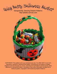 a basket filled with candy on top of an orange background