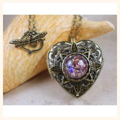 Amethyst Opal Music Box Locket #jewelry #Uniquehandmadegifts #charsfavoritethings #handmade #holidaygift Bronze Heart Pendant Necklace For Gift, Antique Gold Heart Pendant Locket Necklace For Keepsake, Antique Gold Heart Locket Necklace For Keepsake, Bronze Heart-shaped Jewelry For Gifts, Bronze Heart-shaped Necklace For Gift, Heart-shaped Bronze Jewelry For Gifts, Heart-shaped Bronze Necklace For Gifts, Antique Brass Heart Pendant Locket Necklace, Heart Pendant Metal Locket Necklace For Keepsake