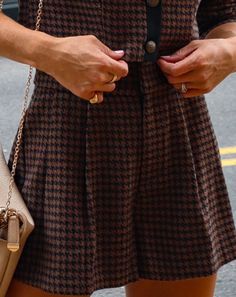 True to Size 100% Polyester Hand Wash Cold. Dry Flat High Rise Pocketed Front Zipper and Hook Closure Not Lined Posh meets preppy in the Tres Fabulous Houndstooth Shorts in brown and black that features a high rise.Styled with: Stella Clutch. Tres Jacket. and Fantasy Heel.---SIZE AND FIT---Model is Wearing a Size Small. Height is 5'8"". Bust is 35â€? Waist 26â€? and Hips 36â€?/span> Size S: Length measures 14.75â€?from waist to hem with a 11â€?rise. 2.25â€?inseam and 26â€?waist Size M: Length measures 15â€?from waist to hem with a 12â€?rise. 2.5â€?inseam and 28â€?waist Size L: Length measures 16â€?from waist to hem with a 112.5â€?rise. 3â€?inseam and 30â€?waist Brown Workwear Shorts For Spring, Brown Shorts For Workwear, Brown Workwear Shorts, Brown Shorts For Workwear In Fall, Brown Shorts For Workwear And Fall Season, Trendy Brown Shorts For Workwear, Chic Workwear Shorts For Fall, Brown Workwear Shorts For Fall, Trendy Brown Workwear Shorts