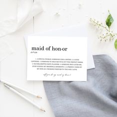 a piece of paper with the words maid of honor written on it