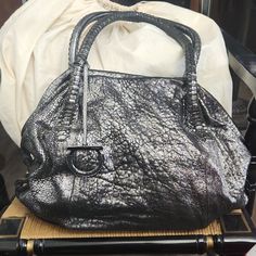 Crackle Gunmetal, Magnetic Closure. Purchased At Saks. No Rips Tears Or Stains. Slight Rubbing On Handles. Personal Bag. Leather Treated Monthly. Kept In Temp Controlled Closet. Closet Over Flowing. Too Gorgeous Not To Be Carried. See All Photos, Ask Questions. Reasonable Non Insulting Offers Always Considered. Comes With Unbranded Duster Packing Will Be Recorded Measurements/Size: 16”W X 8.5”H X 6.5” Evening Tote Shoulder Bag With Silver-tone Hardware, Metallic Rectangular Bag With Silver-tone Hardware, Ferragamo Hobo Bag, Salvatore Ferragamo Sofia Bag, Salvatore Ferragamo Bags Vintage, Salvatore Ferragamo Bags, Magnetic Closure, Salvatore Ferragamo, Size 16