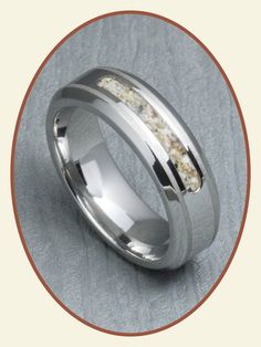 a wedding ring with white gold inlays