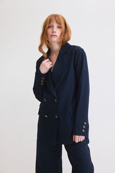 Are you ready to make a bold style statement while staying effortlessly chic? Look no further than our Boyfriend Blazer, a fashion-forward addition to your wardrobe that seamlessly marries the relaxed comfort of a boyfriend fit in classy navy. Spring Formal Peacoat With Button Closure, Chic Navy Blazer With Notch Lapel, Navy Blazer With Button Cuffs For Work, Navy Button-up Blazer For Fall, Fall Navy Button-up Blazer, Tailored Spring Peacoat For Workwear, Chic Double-breasted Peacoat, Chic Navy Blazer For Business, Chic Navy Blazer For Business Casual