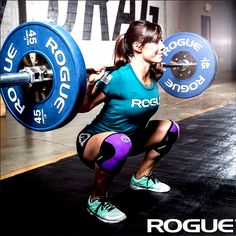 a woman squats with a barbell on her chest and the caption reads,