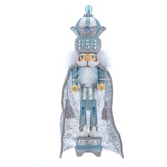 a glass figurine of a nutcracker wearing a crown