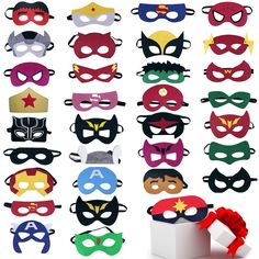 a bunch of masks with different colors and designs on the front, one has a red bow