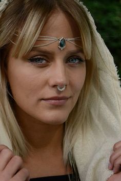 The Silver Head Chain features a drop-shaped gemstone with round balls on the lower edge. Worn draped over the crown of the head or as a Necklace. The Labradorite centrepiece is decorated with 3 chains draped on each side. This piece of jewelry work well dressed up or worn casually. This timeless design is perfect for festivals, weddings & any day that needs some extra sparkle! Size Guide: Adjustable size with a lobster clasp on the backside Material: Brass (nickel free) Stone: Drop-shaped L Septum Sizes, Tiny Bath, Septum Jewelry, Head Chain, Weird Shapes, Nose Rings, Nose Ring Stud, Vermeil Jewelry, Well Dressed