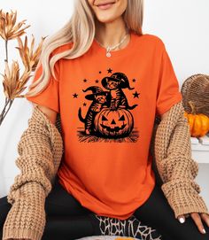 Cat Witches Funny Halloween T-Shirt, Vintage Cat Witch Shirt, Funny Halloween T-Shirt, Halloween Pumpkin Shirt, Halloween Pumpkin Cat Shirt **Product Overview   We proudly offer shirts from the Bella Canvas and Gildan SoftStyle collections, both recognized for their superior industry standards. *Bella Canvas:*   - Available in unisex sizing   - Lightweight fabric at 4.2 oz   - Solid colors are crafted from 100% Combed and Ring-Spun Cotton   - Athletic Heather contains 90% Combed and Ring-Spun Co Spooky Cat Print Crew Neck T-shirt, Orange Crew Neck Top For Halloween, Casual Halloween Cat Design T-shirt, Fall Cat Design Short Sleeve T-shirt, Short Sleeve T-shirt With Cat Print For Halloween, Fall Season Cat Design Short Sleeve T-shirt, Fall Short Sleeve T-shirt With Cat Design, Halloween Graphic Tee With Cat Design, Halloween Cat Print Graphic Tee