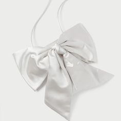 Evening Crossbody Bag In Cream Satin With An Oversized Bow. Features A Magnetic Closure And Lined Interior. Dimensions W: 4.5" X D: 0.5" X H: 7" 20" Strap Drop Materials 72% Viscose 28% Silk Formal Shoulder Bag With Detachable Bow, Chic Formal Shoulder Bag With Bow, White Rectangular Shoulder Bag With Bow, Elegant White Evening Bag With Detachable Strap, Luxury Formal Shoulder Bag With Bow, Elegant Formal Shoulder Bag With Bow, Chic White Evening Bag, White Party Bag With Bow, White Party Bags With Bow