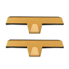 two gold metal door handles on white background