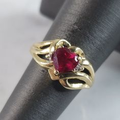 A Womens Vintage Estate 10k Yellow Gold Ruby Heart Ring , Accented With Diamond Chips. The Total Weight Is 2.7g, And Is A Size 5.5. Ring Is Marked "10k". Any Questions Please Dont Hesitate To Ask. Be Sure To Check Out Some Of Our Other Great Items Up For Sale. Thank You. Ruby Heart Ring, Ruby Heart, 5 Rings, Womens Jewelry Rings, Red Gold, Lady In Red, Heart Ring, Ruby, Chips