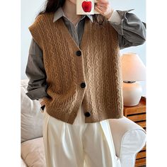 V-Neck Knitted Vest Cardigan Fabric: 42% acrylic + 31% nylon + 27% polyester Size: M, L Multiple Color Selections: Camel, Gray  Season: Spring, Fall, Winter, Vest Cardigan, Knit V Neck, Knitted Vest, Sleeveless Cardigan, Cardigan Vest, Knit Vest, Multiple Color, Season Spring, Free Size