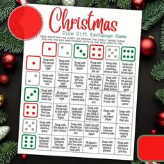 a christmas dice game is shown with ornaments around it