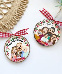 two personalized christmas ornament hanging on a wall next to a red and white checkered ribbon