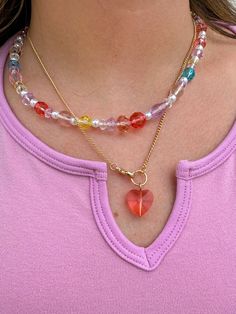 The perfect summer accessory- necklaces with the cutest rainbow beads!! Adds some fun and color to every outfit and is THE necklace of the summer!! Approx. Length 16.5+2" Add another necklace! Fruity Charm Necklace https://www.aspynandivy.com/products/fruit-charm-necklace?_pos=2&_sid=52fe803c9&_ss=r Trendy Heart Beads Charm Necklaces For Jewelry Making, Trendy Heart Beads Charm Necklace For Jewelry Making, Trendy Colorful Necklace With Tiny Beads, Trendy Charm Necklaces For Jewelry Making, Rainbow Necklaces With Heart-shaped Beads, Heart Shaped Necklaces For Summer Gifts, Heart-shaped Summer Necklaces Perfect As Gifts, Trendy Crystal Necklace With Beaded Chain, Trendy Multicolor Heart Necklace