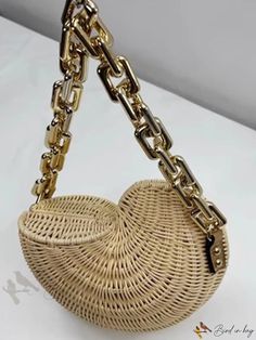 Bird in Bag - Chain Strap Straw Bag Shell Design Gold Bucket Bag With Gold-tone Hardware, Trendy Beach Bag With Chain Strap, Trendy Gold Bucket Shoulder Bag, Gold Beach Bag With Chain Strap, Gold Shopping Bag With Chain Strap, Gold Shoulder Bag With Chain Strap For Beach, Trendy Gold Shoulder Bag For Spring, Trendy Gold Vacation Bag, Trendy Gold Bag For Vacation