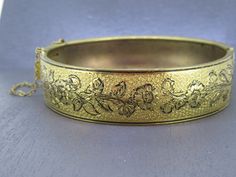 Stunning vintage hinged bracelet with beautiful floral detailing, stunning piece.  Has a box clasp that works great.  Great detail.  Has some age related wear and patina. Signed with a patent.  Visit Ribbons Edge for more great pieces of vintage and antique jewelry!  All items added to your cart at Ribbons Edge will automatically combine shipping. To stay up to date with my newest offerings, follow me on IG @ RibbonsEdge Antique Formal Bracelets With Box Clasp, Victorian Hinged Cuff Bangle Bracelet, Victorian Hinged Cuff Bracelet, Antique Hinged Cuff Bracelet Bangle, Antique Hinged Bangle Cuff Bracelet, Antique Hinged Cuff Bracelet, Victorian Etched Cuff Bracelet For Formal Occasions, Vintage Formal Bracelet With Box Clasp, Antique Cuff Bracelet For Formal Occasions