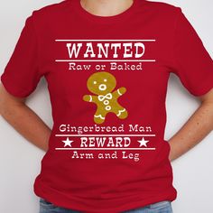 a woman wearing a red t - shirt that says wanted raw or baked gingerbread man reward arm and leg