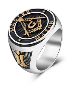 a black and gold signet ring with the letter j on it's center