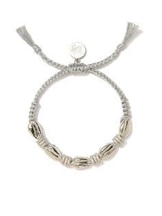 Nothing says "Shell yeah!" like our Shimmering Shells Bracelet! Featuring plated metal shells and pave rhinestone charms, this bracelet will make you feel like you're walking on the beach (even if you're stuck at the office). 6" Adjustable silver threadwork Drawstring closure (extendable up to 8") Silver plated brass hardware and shells Pave rhinestones Handmade in New York City and Puerto Rico. Due to the handmade nature of our products, some charms may vary in color and style or be replaced if Shells Bracelet, Shell Yeah, Walking On The Beach, Shell Bracelet, Hair Rings, Bracelet Silver, Brass Hardware, Ring Bracelet, Men Necklace