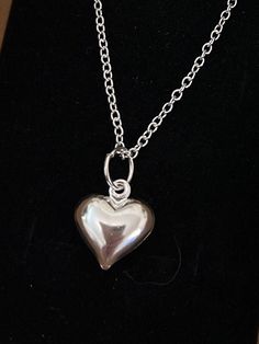 Heart charm necklace. Add a touch of elegance to your wardrobe with this beautiful silver heart necklace. Handmade with love to elevate any look.  The silver chain is 20 inch in length and fastens with a lobster clasp. 1.2mm thick. Free shipping to UK buyers. Dispatched within 1-3 days but I aim for next day postage.  presented on a gift card and wrapped beautifully in luxury tissue paper and a blush pink organza bag making these the perfect gifts for loved ones. If you aren't completely in LOVE with your purchase, please let me know and you'll receive a stress free refund. Customer satisfaction is my key priority.  These are perfect for any occasion, weddings, brides or bridesmaids gifts.  Thank you for viewing. Please ask any questions, I am always available to help. I have other pieces Luxury Silver Necklace With Heart Charm, Heart Charm Necklace, Silver Heart Earrings, Silver Heart Necklace, Wedding Jewellery, Wedding Jewellery Necklace, Gifts Wedding, Bridesmaids Gifts, Necklace Handmade