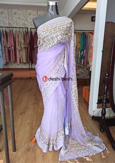 This exclusive boutique designer hand made Muslin saree is a perfect and unique choice for your occasional and party wear. All Over Thread Embroidery, Pearls, Sequences, Tassels, and Detail Hand Work. Fall & Pico Available. Matching Running Blouse Piece. Color: There might be slight color variation due to lightings and flashes while photo shooting. The color may also vary because of different screen resolutions. Wash Care: Dry Clean Only. Note: This is a hand made boutique saree and could take 1 Unstitched Purple Pre-draped Saree With Dori Work, Purple Pre-draped Saree With Dori Work, Embroidered Purple Georgette Pre-draped Saree, Purple Semi-stitched Chinon Saree, Designer Dori Work Pre-draped Saree In Dola Silk, Purple Georgette Embroidered Fabric For Reception, Purple Chinon Saree With Cutdana, Semi-stitched Purple Chinon Saree, Silk Saree With Zari Work For Reception