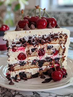 a piece of cake with cherries on top