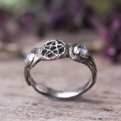 "This dainty witchy ring, made of sterling silver and two rainbow moonstone gemstones on the sides of the moons. Triple moon ring - The triple moon symbol shows the waxing, full and waning moon of feminine energy through all phases of life -- Maiden, Mother and Crone. The five points of the pentagram represent fire, water, air, earth and spirit. Magick jewelry. Measurements and details: * The ring was made in the lost wax technique, it was hand carved in wax and was casted in silver. * Size: The Magical Silver Moonstone Ring, Mystical Sterling Silver Moonstone Ring, Mystical Sterling Silver Moonstone Ring With Moon Phase, Magical Silver Moonstone Wedding Ring, Silver Moonstone Ring For Wedding, Magical Silver Sterling Silver Moonstone Ring, Magical Sterling Silver Moonstone Ring, Magical Silver Jewelry With Sun And Moon Design, Magical Moonstone Sterling Silver Ring