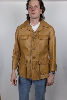 "For sale is a vintage jacket.  Has a few pulling seams at pockets and side, see photos for detail.  Tagged size 40, seems fairly true to size.  See measurements to ensure proper fit. Measurements laid flat with all buttons fastened: Pit-to-pit chest width: 22\" Waist width: 21\" Length from top of shoulder: 31.5\" Sleeve length from edge of shoulder: 24\" Model is 6'5\" 180lb, wears the following sizes: Dress shirt: 15.5\" neck, 36.5\" sleeve Suit jacket: 42L - 44L depending on cut Pants waist: Vintage Leather Jacket With Pockets, Vintage Outerwear With Flap Pockets For Winter, Vintage Leather Jacket With Long Sleeves For Fall, Vintage Long Sleeve Leather Jacket For Fall, Vintage Outerwear For Fall, Vintage Fashion Fall Outerwear With Pockets, Fall Vintage Fashion Single-breasted Outerwear, Fall Vintage Outerwear, Retro Single Breasted Leather Jacket With Long Sleeves