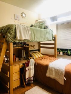 a bunk bed sitting next to a wooden desk