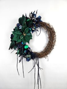 a wreath with blue and green decorations on it