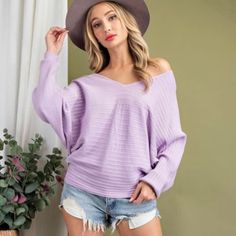 Lilac Lavender V-Neck Batwing Sleeve Sweater New Ribbed Fabric Design Color Is The Same As In The First Picture. My Light Quit Working Pull On Style Tapered Waist Relaxed Fit 50viscose 28%Polyester 22%Nylon Small Pit To Pit 23” Length 26” Large Pit To Pit 25” Length 26” Purple V-neck Top For Winter, Spring Heather Sweater, Chic Purple Sweater For Spring, Chic Purple Spring Sweater, Trendy Purple V-neck Sweater, Spring Lavender V-neck Top, Mauve V-neck Top For Fall, Casual Mauve V-neck Top, Batwing Sleeve Sweater