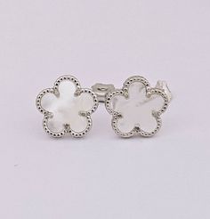 Solid 925 Sterling & Mother of Pearl Clover Earrings  Real 925 Sterling Silver NOT SILVER PLATED High Quality Silver Earrings  High polished rhodium finish gives this earrings a stunning shiny look that lasts many years. We have hundreds Silver Jewelry in stock. If you don't see what are you looking for, feel free to ask us. Trendy, dainty, luxurious, classic with modern touch, elegant and fancy, fine quality made   925 Sterling Silver and mother of pearl earrings Description 925 Sterling Silver Silver Pierced Flower Earrings For Gift, Silver Nickel-free Flower Earrings For Anniversary, Hypoallergenic Silver Flower Earrings For Gift, Hypoallergenic White Gold Flower-shaped Jewelry, Silver Sterling Flower Earrings Hypoallergenic, Dainty Silver Flower-shaped Earrings, Silver Hypoallergenic Flower-shaped Jewelry, Sterling Silver Flower-shaped Earrings, Sterling Silver White Gold Flower Earrings Nickel-free