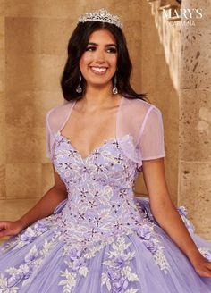 a woman wearing a purple dress and tiara smiling at the camera with her hands on her hips