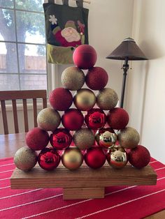 a christmas tree made out of red and gold ornaments