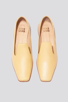 The Olympia Loafer is a babouche-inspired loafer featuring a square boxy toe, a cut-away upper, and a stacked leather heel. Olympia sets itself apart from the typical loafer thanks to its elegant lines. Style the Olympia loafer with suiting for a modern work look or with slip dresses for an elevated, relaxed evening look. Who it’s for: The woman who loves loafers and is looking for a fresh new shape to experiment with. Handmade in Argentina Kidskin leather upper with vegetable tanned leather lin Slip Dresses, Work Looks, Vegetable Tanned Leather, Olympia, Leather Heels, Tan Leather, Leather Upper, Loafers, Square