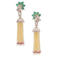 When it comes to exquisite jewelry, few pieces can rival the timeless elegance of natural pearl tassel earrings. These stunning earrings are not only a testament to the beauty of natural pearls, but also a showcase of masterful craftsmanship and design. Crafted with the utmost attention to detail, these fine natural pearl tassel earrings are mounted in 18kt gold, adding a touch of luxury and sophistication to the already exquisite piece. The use of 18kt gold not only enhances the overall aesthetic appeal of the earrings but also ensures their longevity and durability. What truly sets these earrings apart is the addition of emerald and diamonds, further elevating their allure. The vibrant green hue of the emerald complements the lustrous pearls, creating a striking contrast that captures th Art Deco Pearl, Pearl Cocktail Ring, Pearl Chandelier Earrings, Contemporary Bridal, Pearl Chandelier, Platinum Earrings, Jewellery Indian, Saltwater Pearls, Modern Bridal