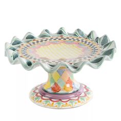 a decorative glass dish with colorful designs on it