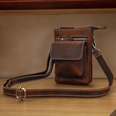 🌟 Elevate Your Style with Our Men's Leather Crossbody Phone Bag! 🌟 Discover the perfect blend of luxury and practicality with our Men's Leather Crossbody Phone Bag. This premium leather bag is designed for the modern man, offering seamless organization and unmatched style. Whether you're on the go or attending an event, this versatile bag can also be worn as a waist bag. ✨ Key Features ✨ 🌟 𝗙𝘂𝗹𝗹 𝗚𝗿𝗮𝗶𝗻 𝗟𝗲𝗮𝘁𝗵𝗲𝗿: Ensures lasting durability and a classic aesthetic.  🌟 𝗔𝗺𝗽𝗹𝗲 ? Brown Rectangular Chest Bag For Mobile Phone, Brown Rectangular Chest Bag With Mobile Phone Pocket, Brown Rectangular Chest Bag With Mobile Phone Holder, Rectangular Brown Chest Bag, Everyday Carry Crossbody Shoulder Bag, Portable Brown Leather Belt Bag, Brown Rectangular Phone Bag With Zipper Pocket, Portable Shoulder Bag For Everyday Carry, Portable Rectangular Bag For Everyday Carry