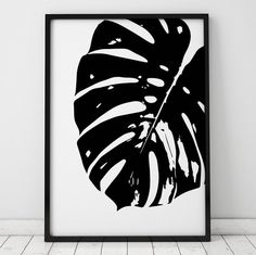 a black and white print of a monster leaf