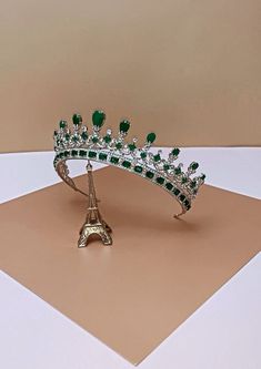 The MAJESTC EMERALD Bridal Crown is one of our most luxurious Bridal Tiara with Stunning Design. It is inspired after Queen Victoria's wedding crown. It is a Majestic Swarovski Bridal Crown that is timeless and classic to complete the bridal look.  The design is made up of tear drop and round crystals with a unique design to give it the an outstanding look. It is a royal statement piece fit for a queen on her wedding day.   Available as Regular Crown ( 3/4 crown) and Full Crown (full circle crow Emerald Crown Queens, Full Circle Crown, Bride Necklaces, Queen Victoria Crown, Queen Victoria Wedding, Emerald Crown, Fantasy Accessories, Green Crown, Royal Crowns